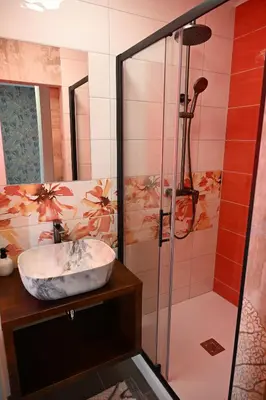 a bathroom with a sink and a shower at Sobe in apartma Portus in Rakek