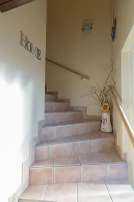 a set of stairs in a house with a vase at Relax Room Bohinjska Bistrica in Bohinj