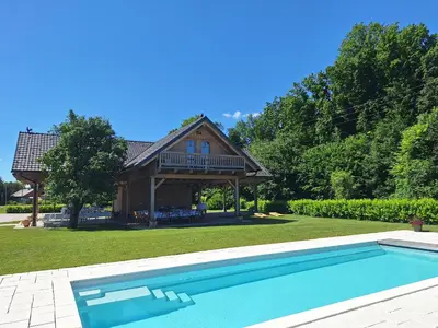 a house with a swimming pool in a yard at Škedenj pri Vili Trate in Križevci pri Ljutomeru