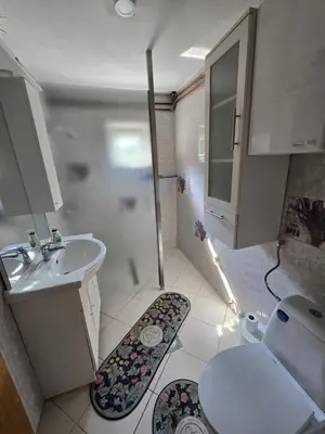 a bathroom with a sink and a toilet at Pri tetki in Kranj