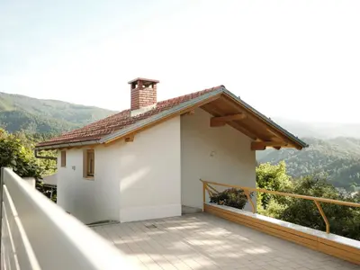 a house with a balcony with a view at Peak & Pause in Bistrica pri Limbušu