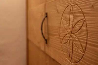 a close up of a wooden door with a drawing on it at House Dorče in Kojsko