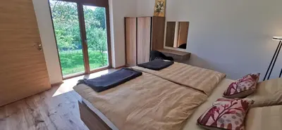 a bedroom with a bed with two pillows on it at Apartment Ratek in Ivanjkovci