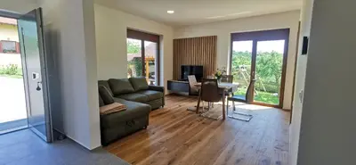 a living room with a couch and a table at Apartment Ratek in Ivanjkovci