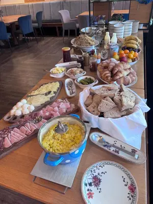 a long table filled with different types of food at Guesthouse Tolc in Spodnja Sorica