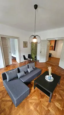 a living room with a couch and a table at Center flat 160m2 in Ljubljana