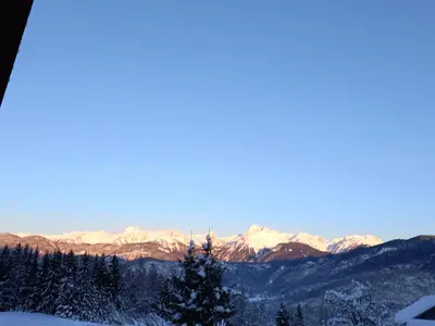 a view of snow covered mountains in the distance at Tubej apartments in Bohinj