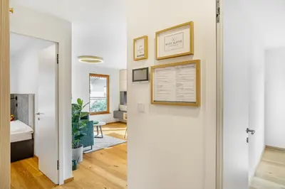 a hallway with a door leading to a living room at West Alpine Apartment SKI in&out in Kranjska Gora