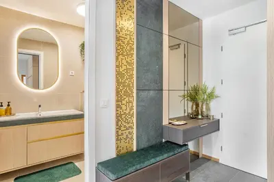 a bathroom with a sink and a mirror at West Alpine Apartment SKI in&out in Kranjska Gora