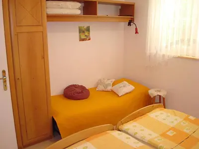 a room with two beds in a room at Apartment Kotnik in Kamnik