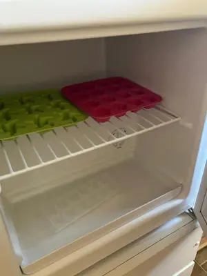 a refrigerator with a tray of food in it at Kozjanski odklop in Buče
