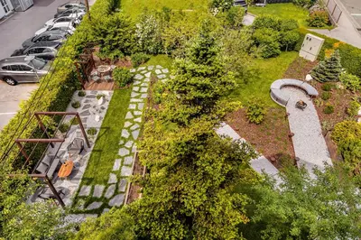 an overhead view of a garden with cars parked in a parking lot at Guest House The Hive in Bled