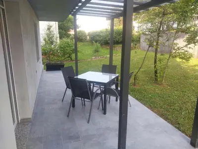 a table and chairs sitting on a patio at APARTMA Črnomelj in Črnomelj