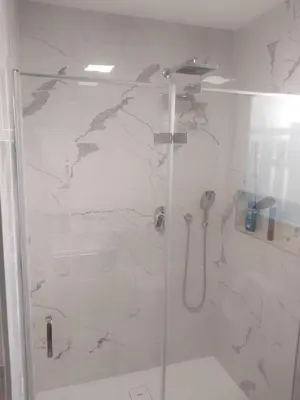 a bathroom with a shower with a glass at APARTMA Črnomelj in Črnomelj
