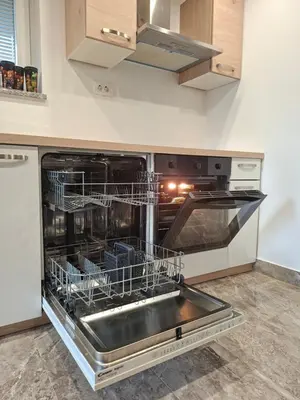 a dishwasher with dishes in it in a kitchen at Sun House Luka in Radmirje