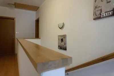 a kitchen with a wooden counter top on a wall at Apartments Kravanja in Bovec