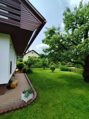 a view of a yard with a house at Traditional Bled Stay in Bled