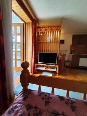 a bedroom with a desk with a computer on it at Traditional Bled Stay in Bled