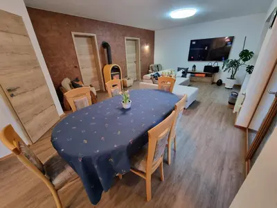 a dining room table with a blue table cloth and chairs at Luna's Mountain House - Jezersko in Zgornje Jezersko