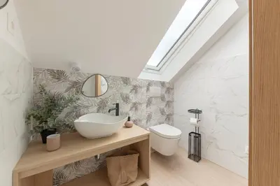 a bathroom with a sink and a toilet at House Pr'Španc in Ljubljana