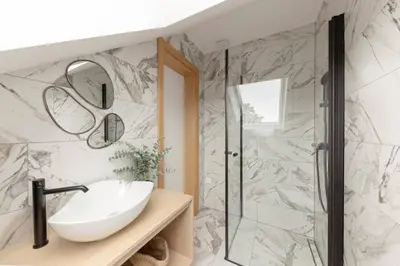 a bathroom with a sink and a shower at House Pr'Španc in Ljubljana