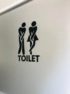 a toilet sign on the side of a laptop computer at Glamping - domačija Lamperček in Velenje