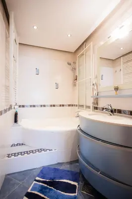 a bathroom with two sinks and a tub at The Color Loft in Ljubljana