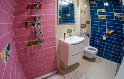 a pink bathroom with a sink and a toilet at Rosa & Nora Apartments in Ljubljana