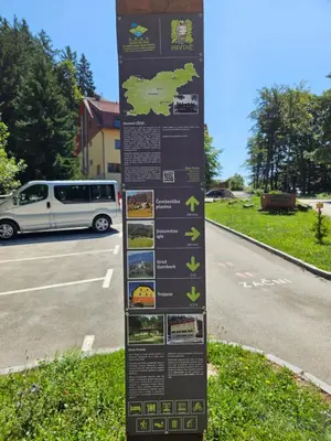 a sign on the side of a road at Hiška pod krošnjami