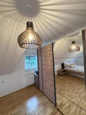 a bedroom with two lights and a bed in a tent at Rezidenca Vista Lux in Ptuj