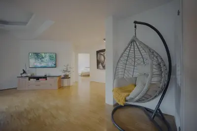 a room with a swing hanging from a wall at Rezidenca Vista Lux in Ptuj