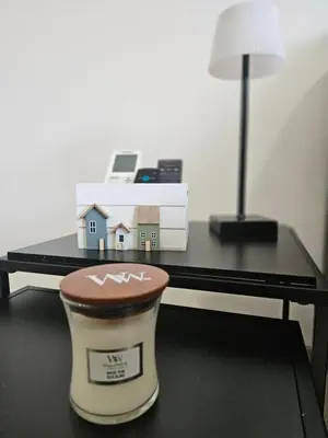 a coffee cup with a house on top of a table at Apartma VINT in Ajdovščina