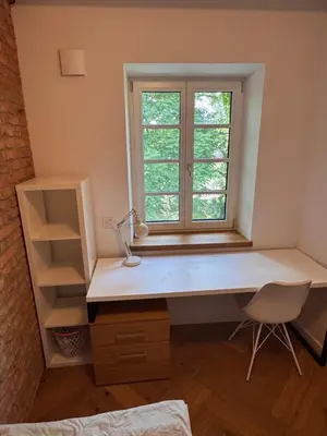 a desk with a window in a room at Enchanting appartment Eipprova in Ljubljana