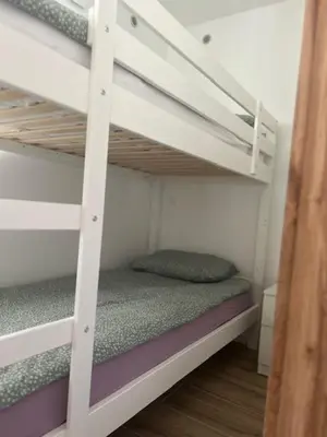 a couple of bunk beds in a room at Natura in Radovljica