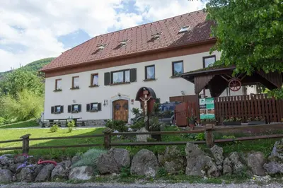 a house with a fence in front of it at Turistična Kmetija Toman in Gornji Grad