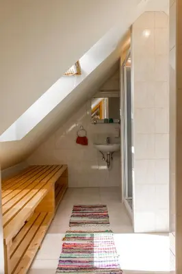 a bathroom with a sink and a staircase at Turistična Kmetija Toman in Gornji Grad