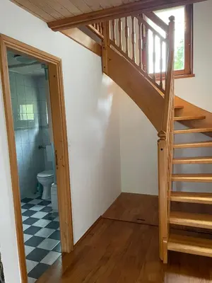 a staircase leading up to a bathroom with a toilet at Sedmakovo - Počitniška hiša v naravi - Ljubno ob Savinji in Ljubno