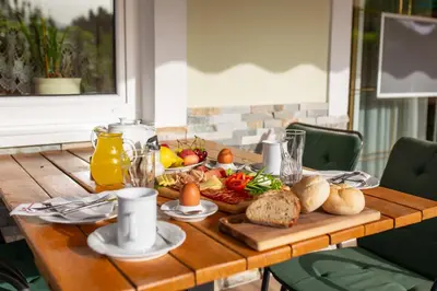 a table with a tray of food on it at Gostišče Pri Dveh Petelinih in Bled