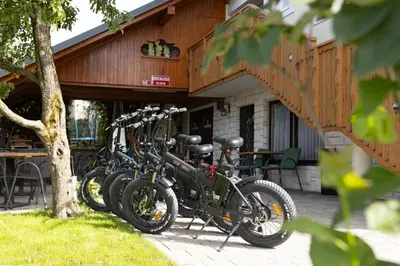 a row of bikes parked in front of a building at Gostišče Pri Dveh Petelinih in Bled