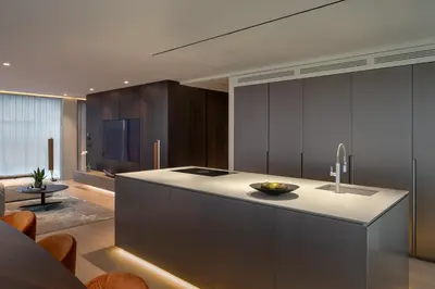 a kitchen with a large island in a room at Castle View Penthouse in Ljubljana