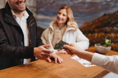 a group of people shaking hands at a table at Menart Estate apartments in Cerklje na Gorenjskem