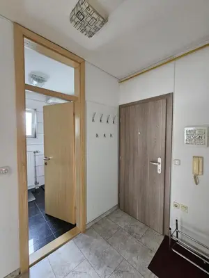 an empty room with a door and a hallway at Designer apartment in nature in Vojnik