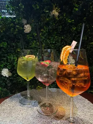 three wine glasses sitting on top of a table at Prenočišča Zvezda in Ljutomer