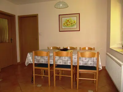 a dining room with a table and chairs at Apartment Vintgar in Slovenska Bistrica