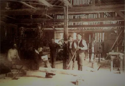 an old photo of a group of people in a factory at Apartment Vintgar in Slovenska Bistrica