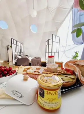 a table with some food on a table at Cozy Fizio Dome in Gradišče v Slovenskih Goricah