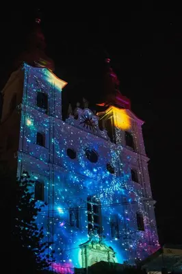 a building with christmas lights on it at night at Cozy Fizio Dome in Gradišče v Slovenskih Goricah