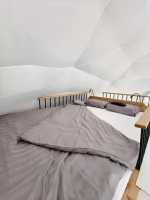 a bedroom with two beds in a tent at Cozy Fizio Dome in Gradišče v Slovenskih Goricah