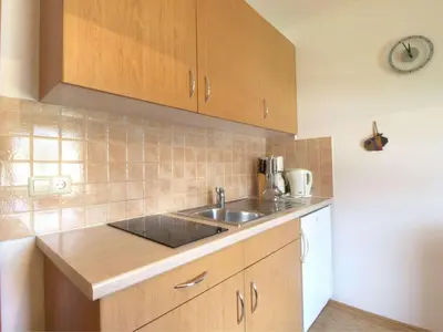 a kitchen with a sink and a counter top at Apartments Mira in Bled