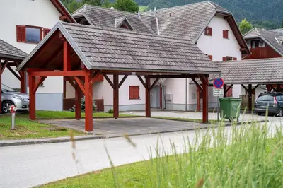 a building with a pavilion in the middle of a street at Apartma Igor in Bohinj